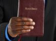 Man Holding a Bible