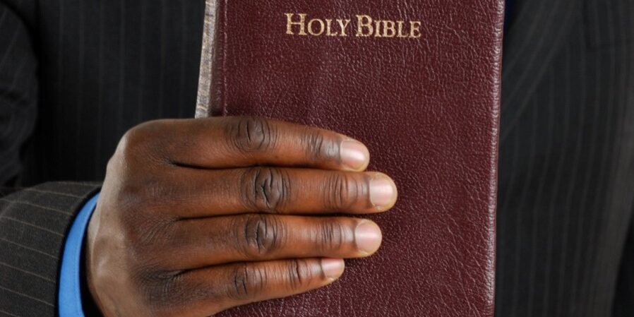 holy-bible Man Holding a Bible